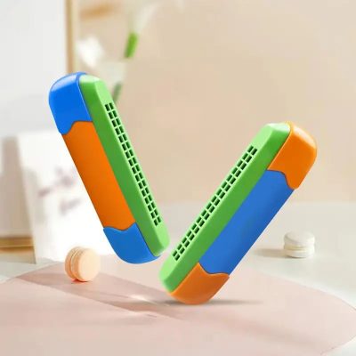 Armónica de 16 agujeros de color naranja y azul