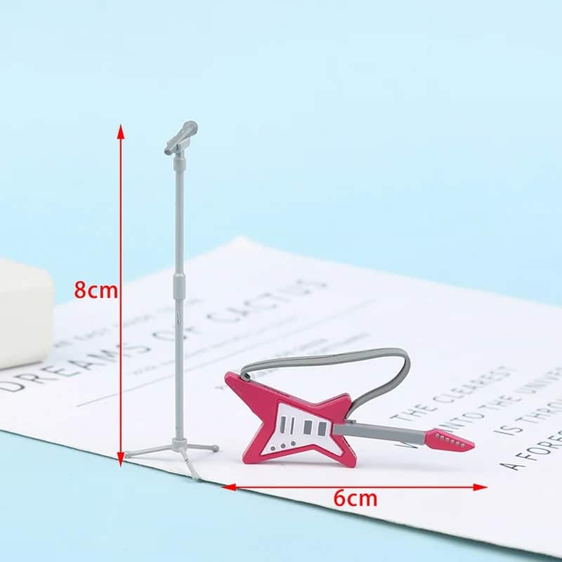 Dimensiones de una miniatura de guitarra eléctrica en forma de estrella de color rosa con micrófono