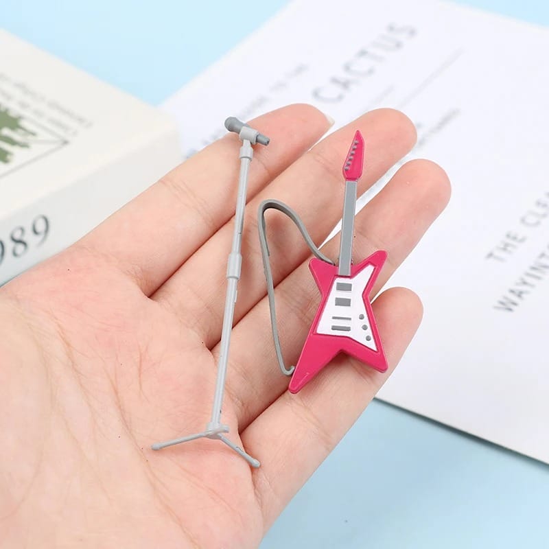 Guitarra eléctrica miniatura estrella rosa con micrófono