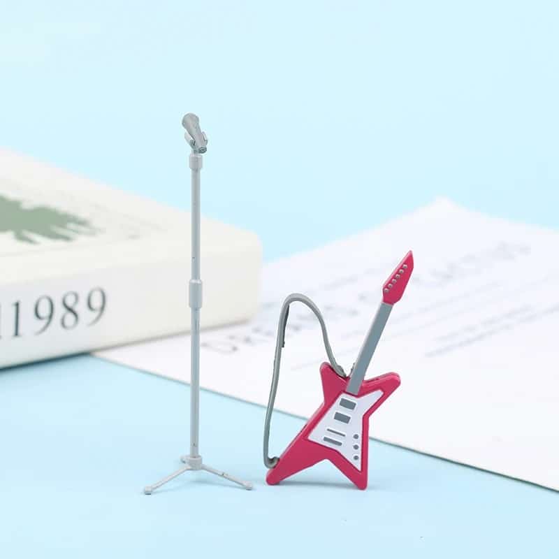 Magnífica guitarra eléctrica miniatura de estrella rosa con micrófono