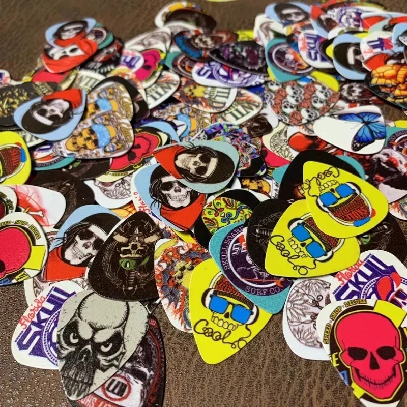 Lote de 10 púas de guitarra con motivos de calaveras y cabezas de muerto
