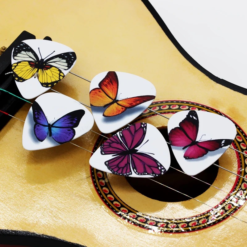 Lote de 10 púas con diseños de mariposas coloridas, disponibles en diferentes espesores