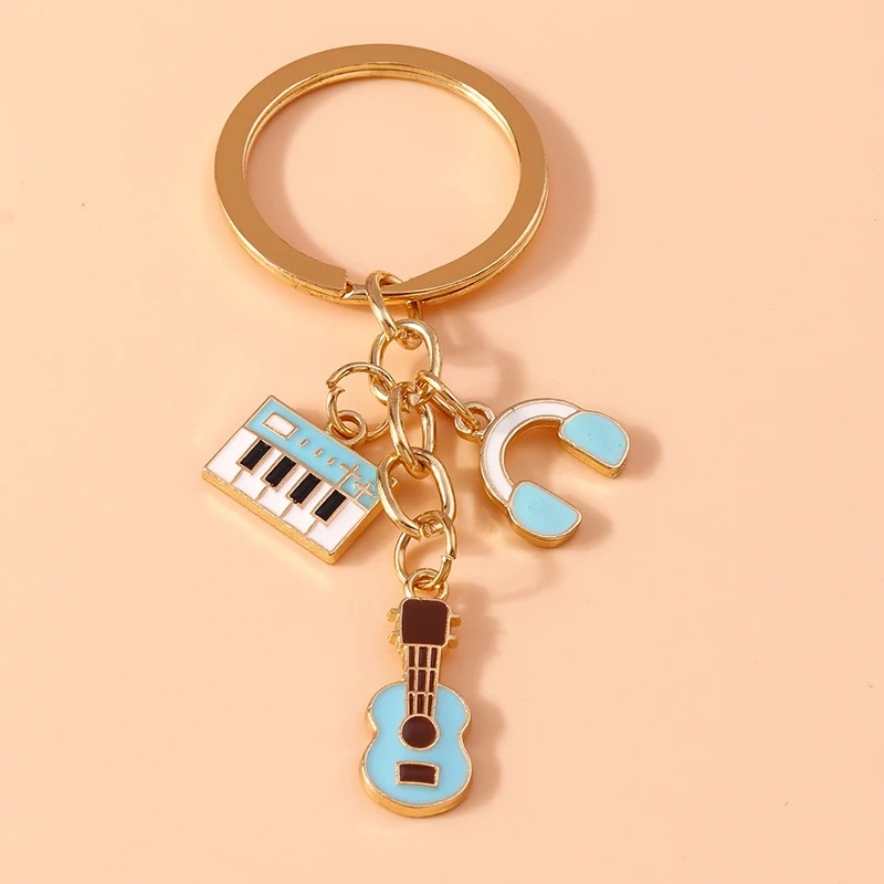 Llavero de guitarra e instrumentos musicales en metal de color azul