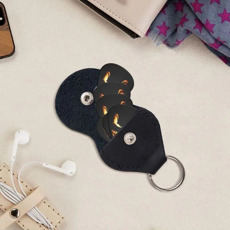 Vista completa del lote de 6 púas de guitarra Sonrisa Maliciosa del Crepúsculo con estuche incluido