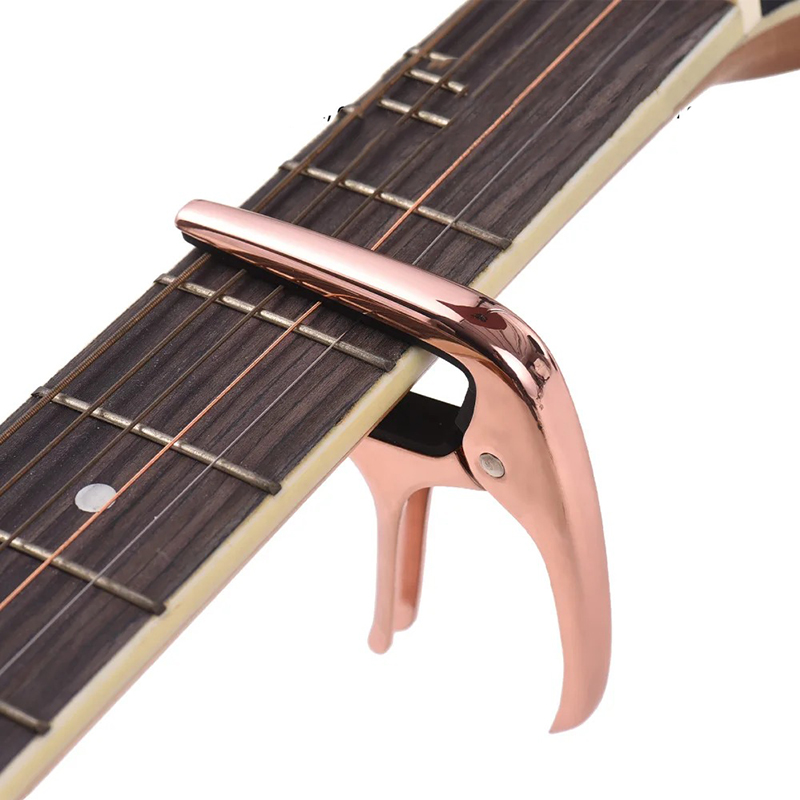 Vista general de la Cejilla de Guitarra Universal de Metal - Colores Premium (Negro, Oro, Plata, Oro Rosa)