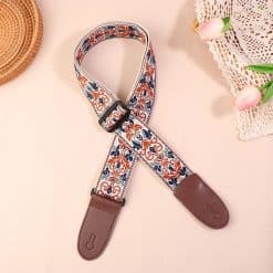 Correa de guitarra vintage con arabescos en azul y ocre