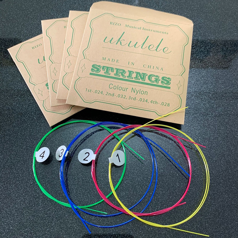 Jeu de 4 cordes de guitare ukulélé en nylon coloré pour ukulélé 212326 pouces universel - couleur arc-en-ciel