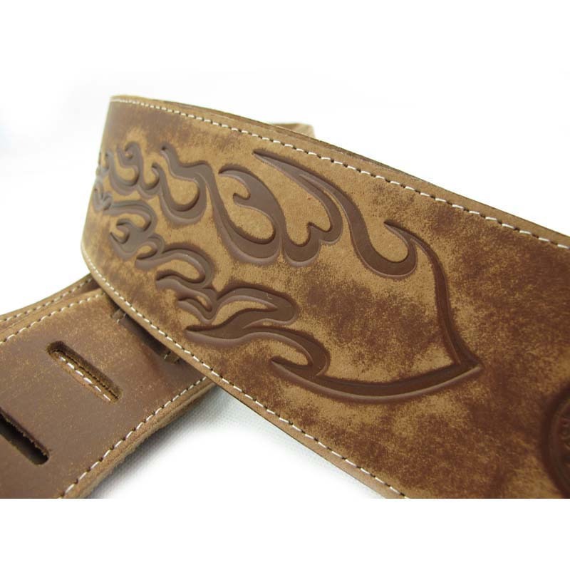 Sangle de guitare ou basse en cuir de vache noir motif flamme sclpté flamme couleur marron détails