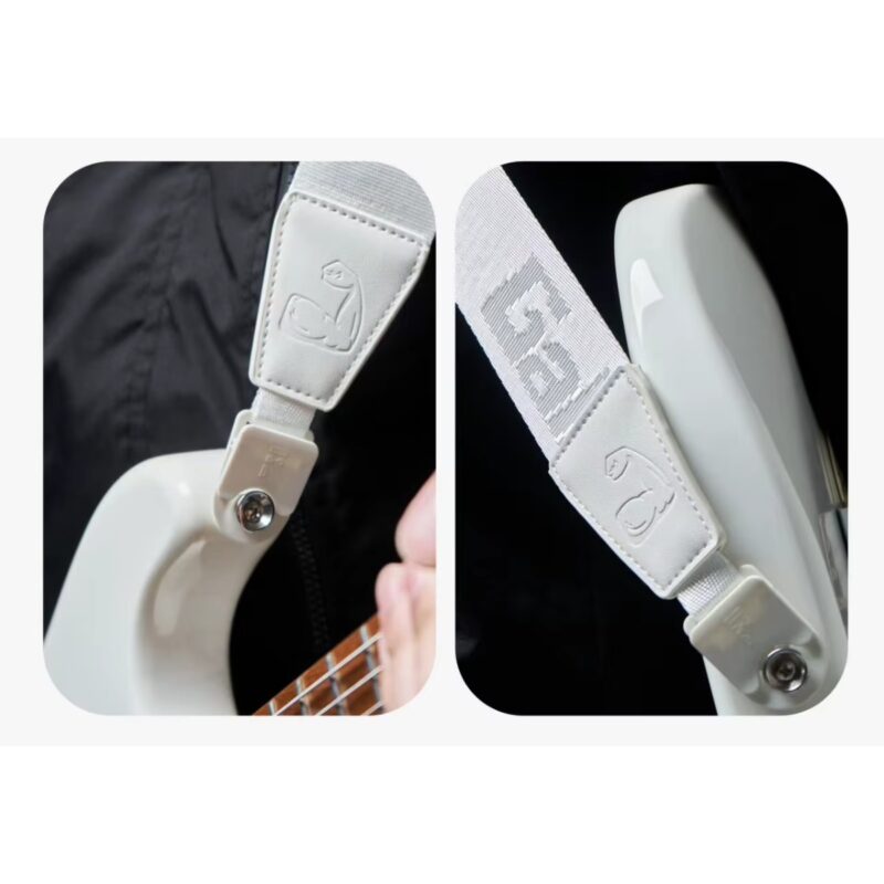 Attache à dégagement rapide et embout allongé anti-rayures de la sangle Power Grip blanche fixés sur une guitare